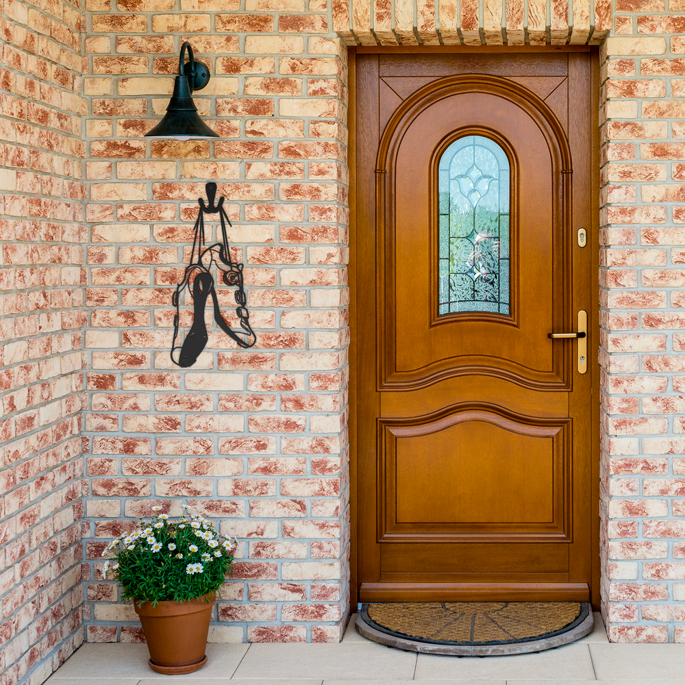 Playful_Cycling_Shoes_Hanging_Metal_Wall_Black_Brick_Entrance_Mockup.png